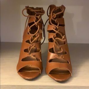 Strappy brown high heel sandals.